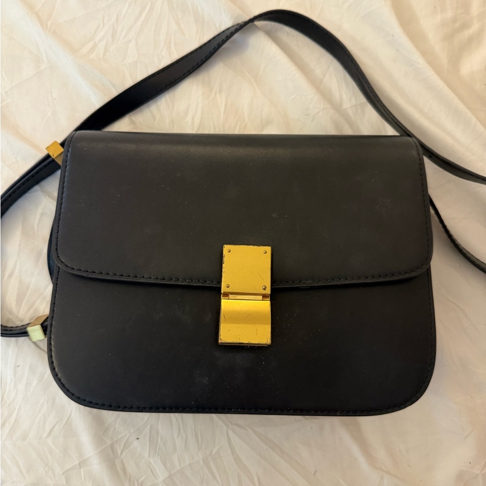 Elegant Black Leather Shoulder Bag with Gold Accent